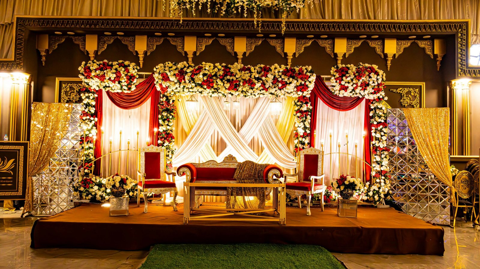 A beautifully decorated stage is ready for a celebration.